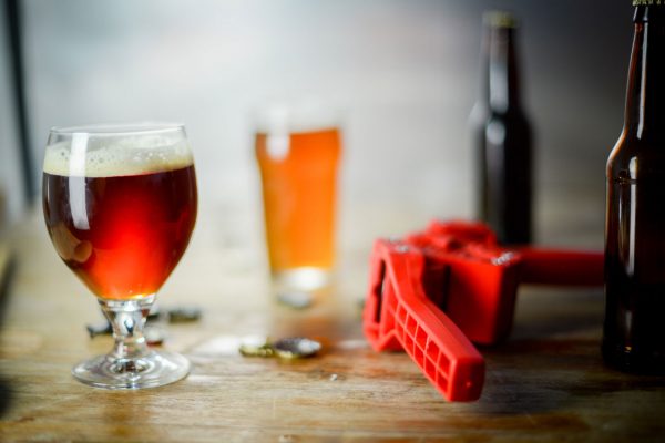 homebrewed beer and bottle capper